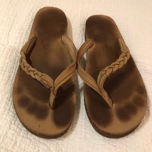 Braided rainbow flip flops